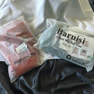 1 red wig and 1 black and green wig